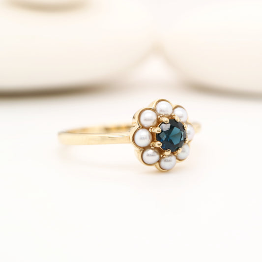 Blue sapphire with pearl halo ring in 9k yellow gold