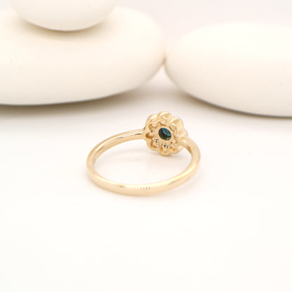 Blue sapphire with pearl halo ring in 9k yellow gold