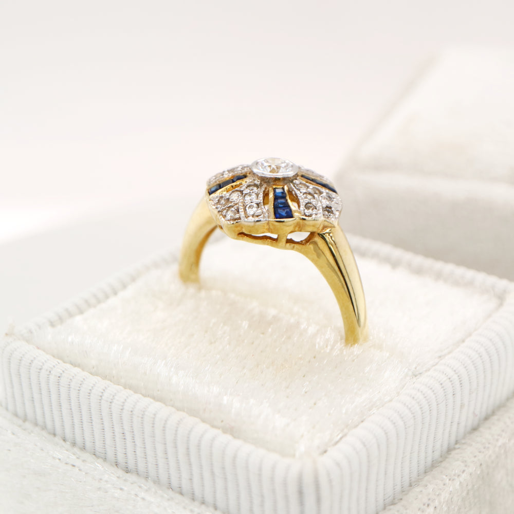 Art deco cross ring in yellow gold with sapphire and diamond