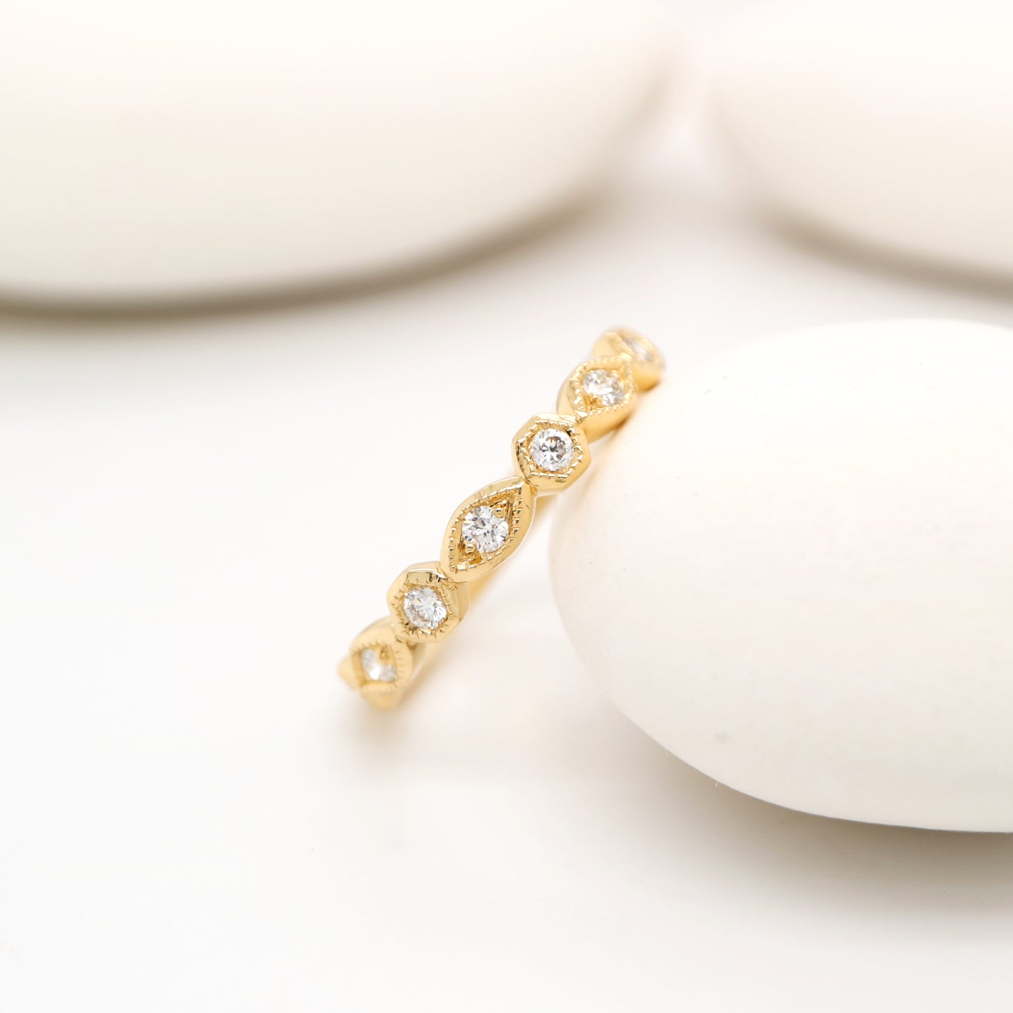 Art deco style half set band in yellow gold with natural diamonds