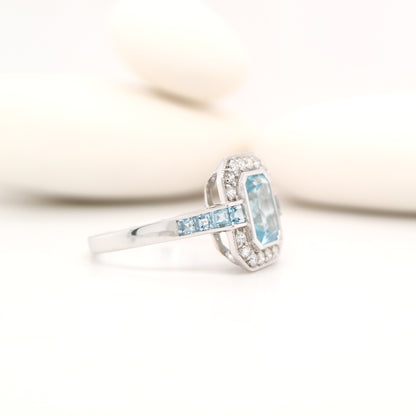 Aquamarine ring in gold with laboratory grown diamond halo