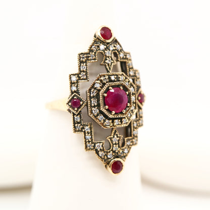 Oxidised gold cocktail ring with ruby and diamonds