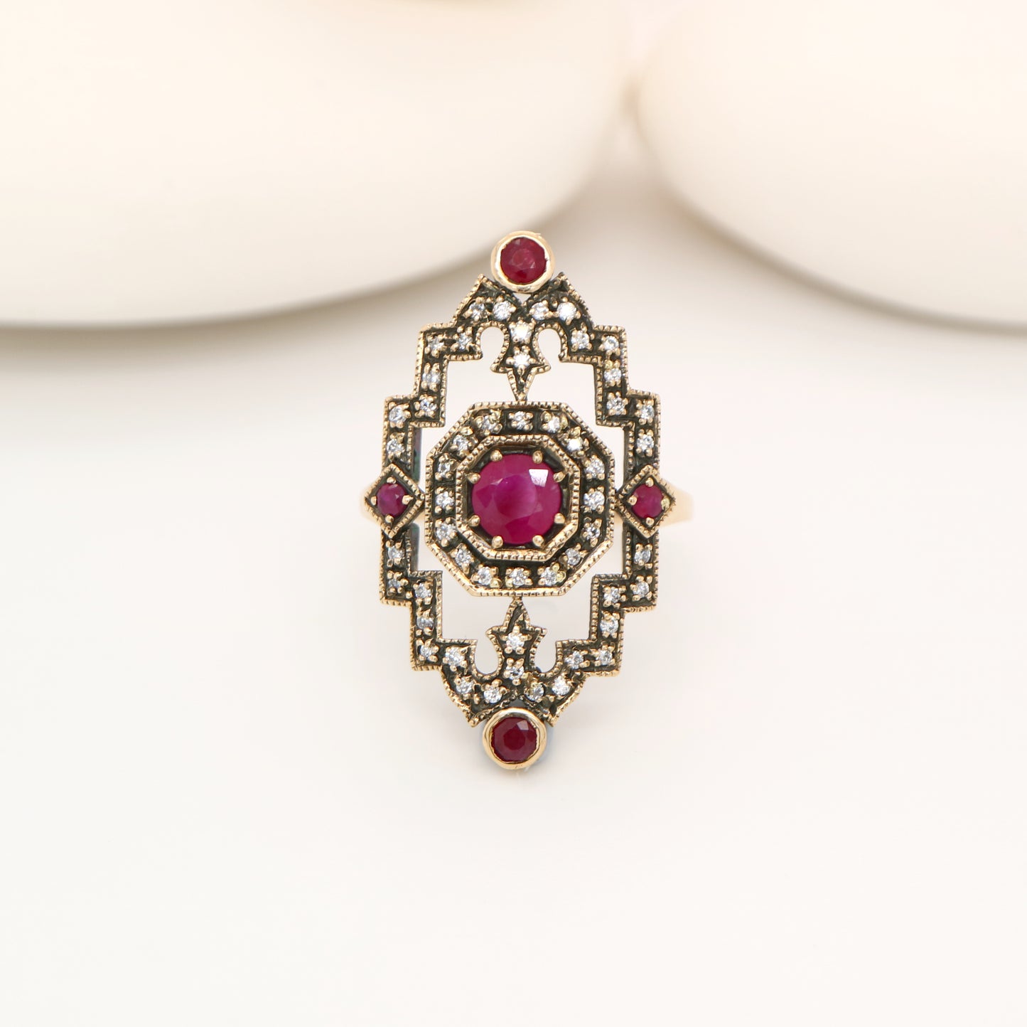 Oxidised gold cocktail ring with ruby and diamonds