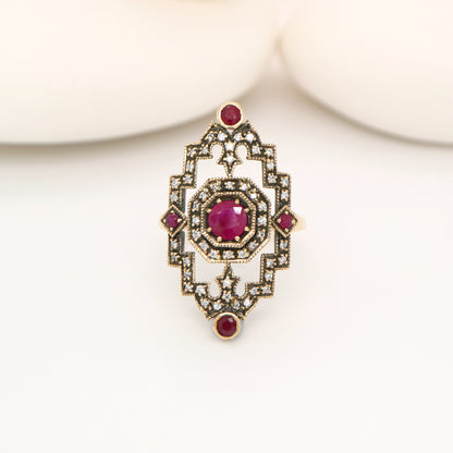 Oxidised gold cocktail ring with ruby and diamonds