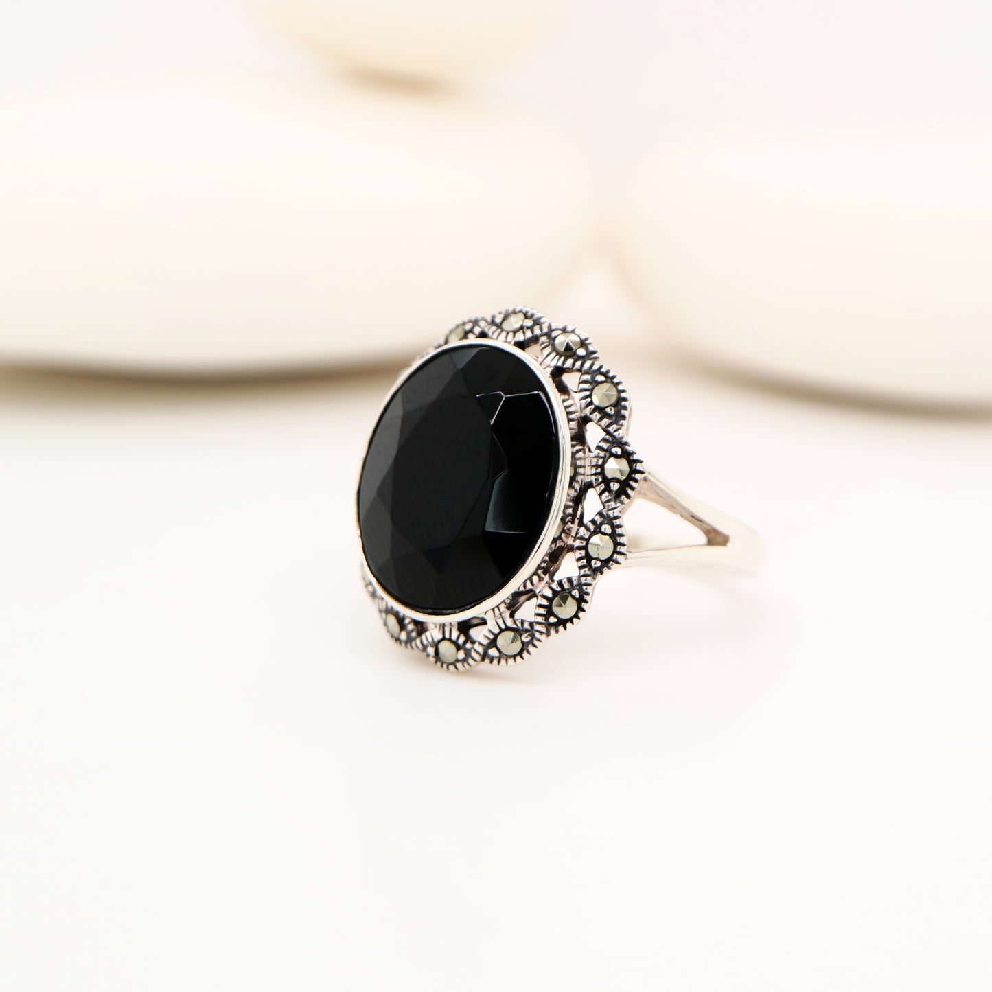 Art deco style black onyx ring with marcasite in scalloped edge in sterling silver