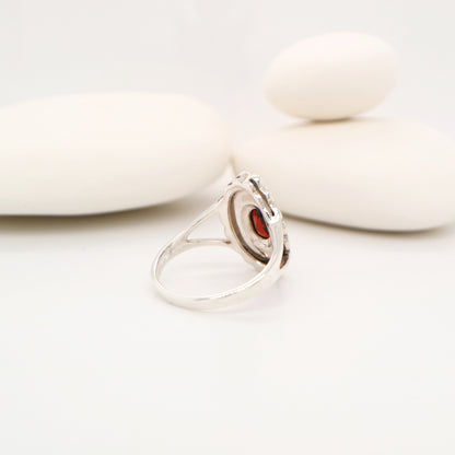 Marcasite shield with garnet ring in sterling silver