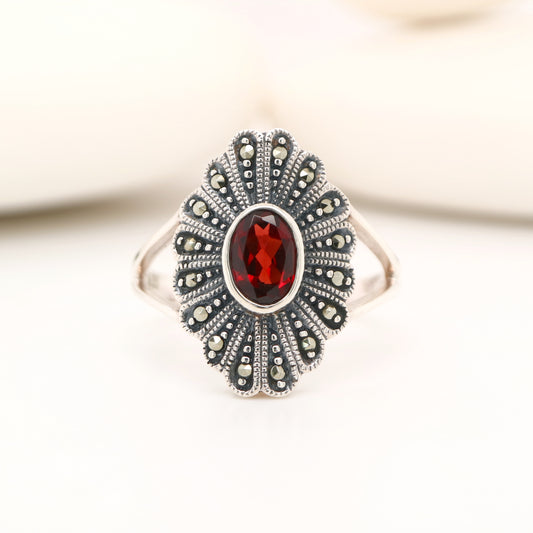 Marcasite shield with garnet ring in sterling silver