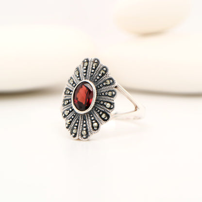 Marcasite shield with garnet ring in sterling silver