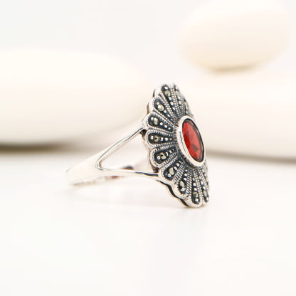 Marcasite shield with garnet ring in sterling silver