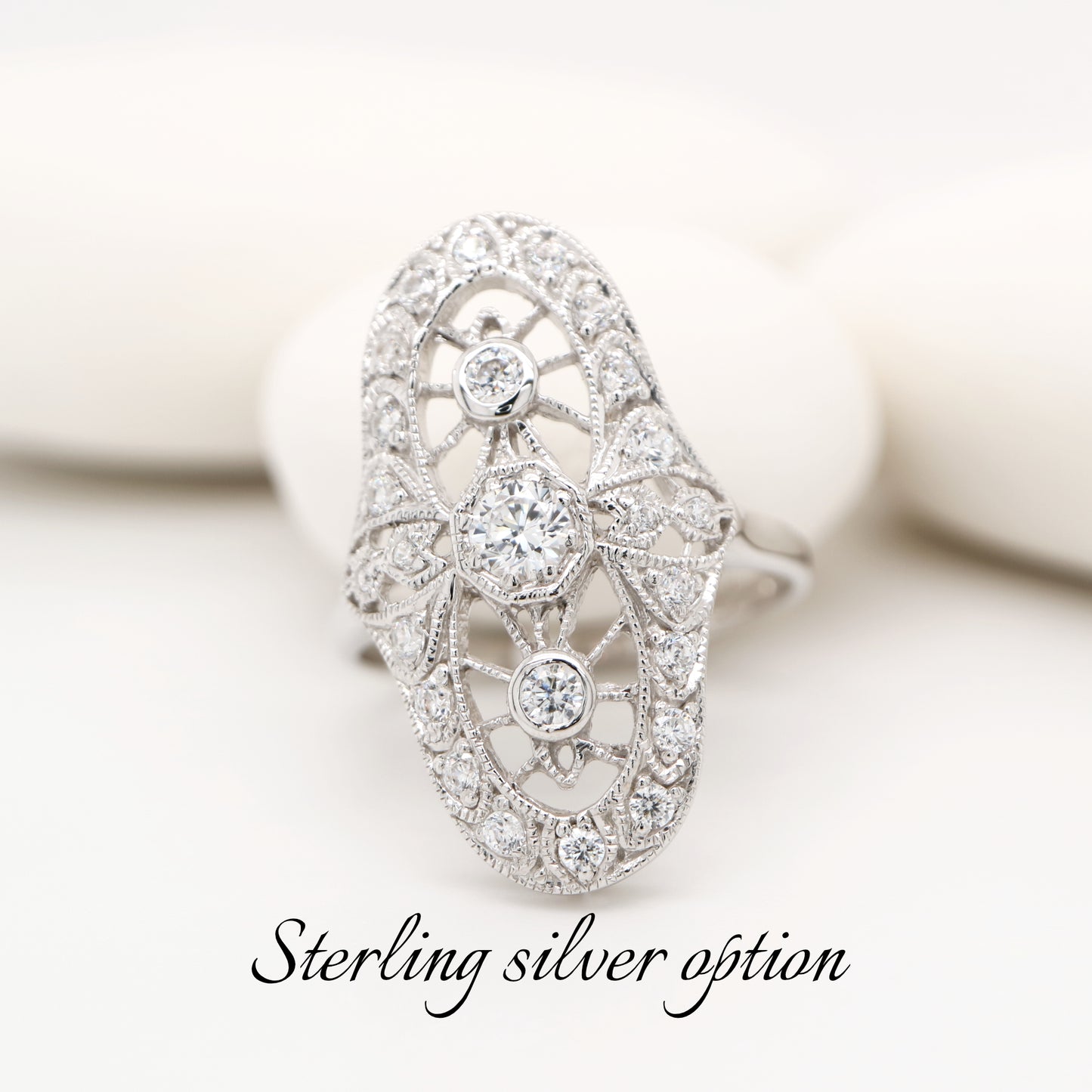 Cocktail halo ring with cubic zirconia in sterling silver
