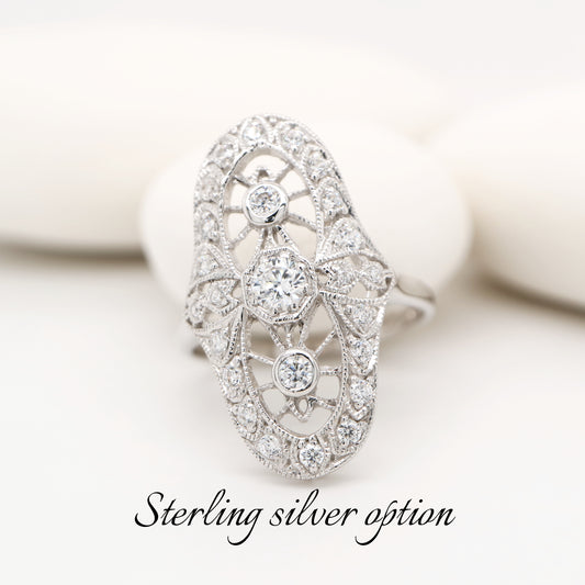 Cocktail halo ring with cubic zirconia in sterling silver