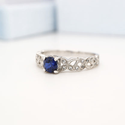 Sapphire solitaire sterling silver ring with cz in leaf pattern