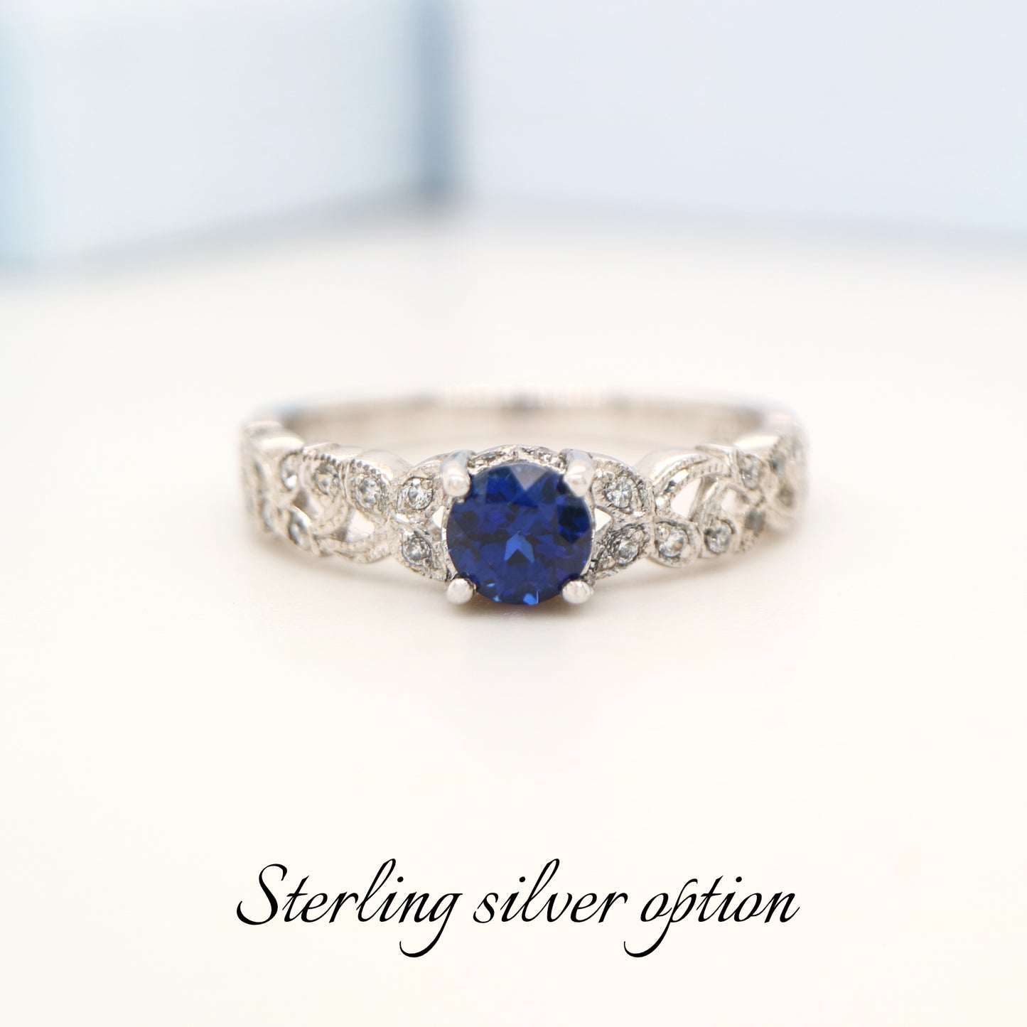Sapphire solitaire sterling silver ring with cz in leaf pattern