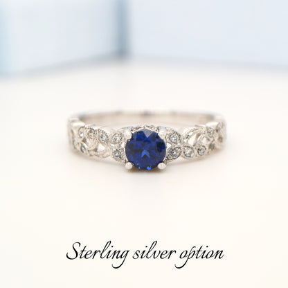 Sapphire solitaire sterling silver ring with cz in leaf pattern