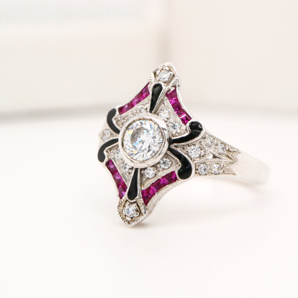 Sterling silver cocktail ring with laboratory grown ruby, cz and black enamel