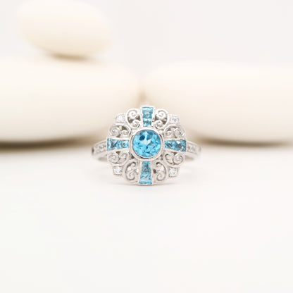 Filigree blue topaz and CZ ring in Sterling Silver