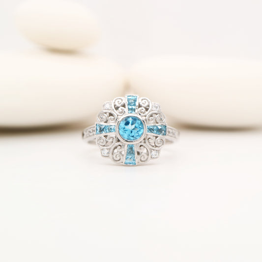 Filigree blue topaz and CZ ring in Sterling Silver