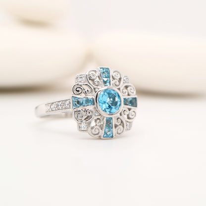 Filigree blue topaz and CZ ring in Sterling Silver