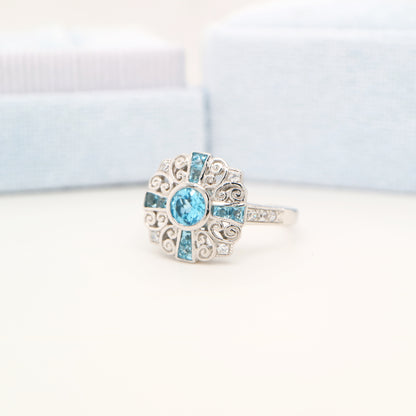 Filigree blue topaz and CZ ring in Sterling Silver