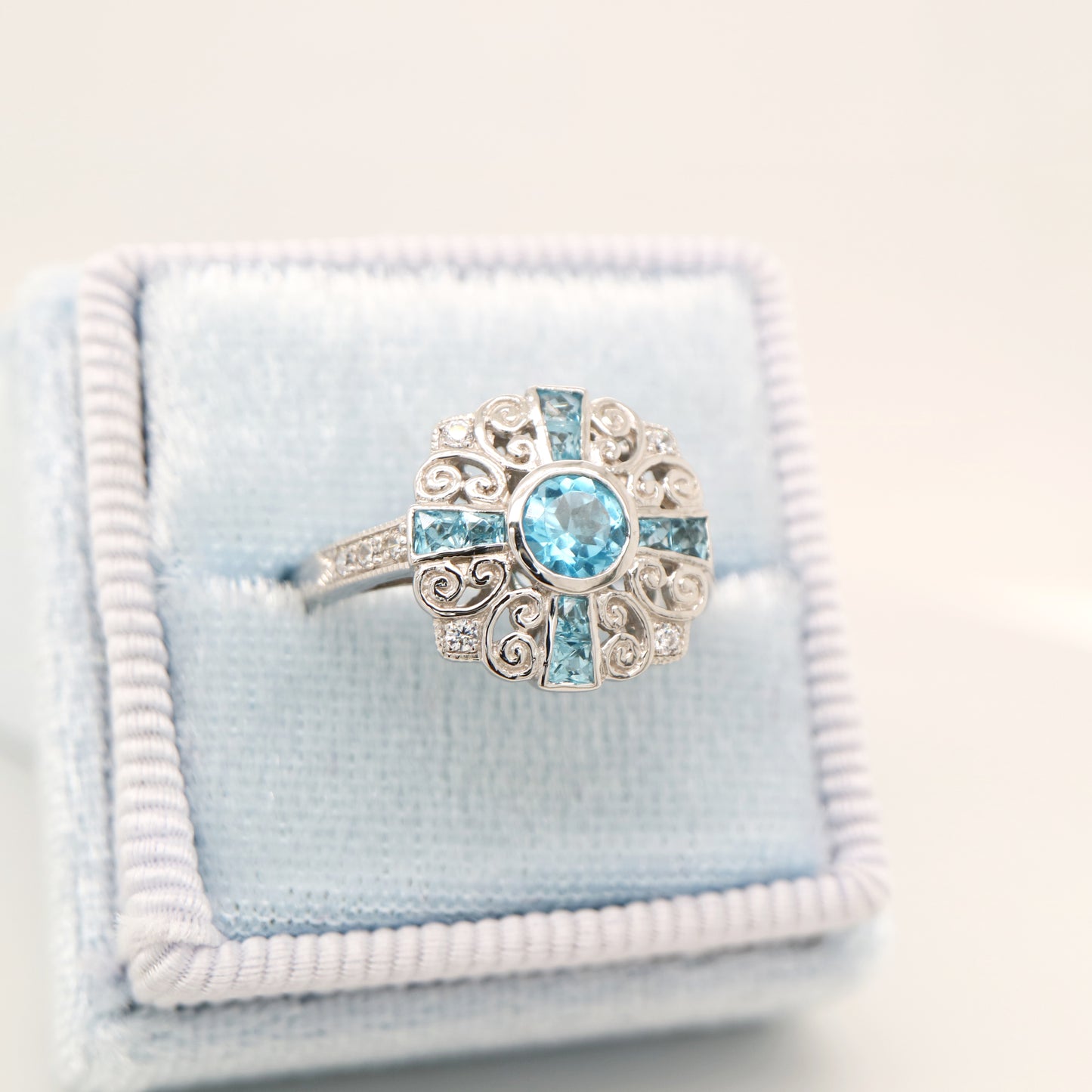 Filigree blue topaz and CZ ring in Sterling Silver