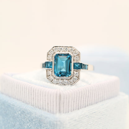 London blue topaz ring in Sterling Silver with CZ halo