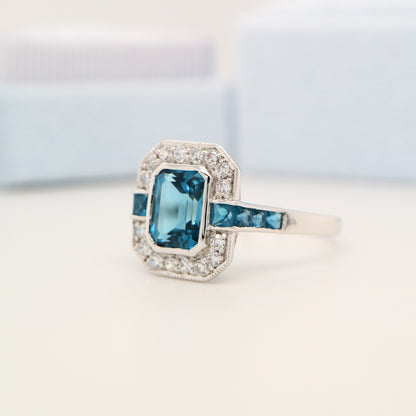 London blue topaz ring in Sterling Silver with CZ halo