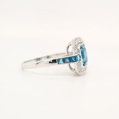 London blue topaz ring in Sterling Silver with CZ halo