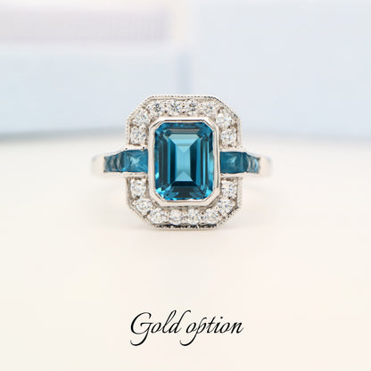 Vintage London blue topaz ring with diamond halo in white gold