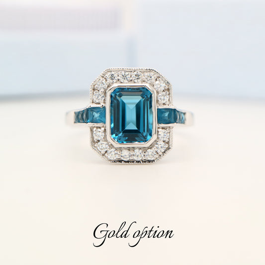 Vintage London blue topaz ring with diamond halo in white gold