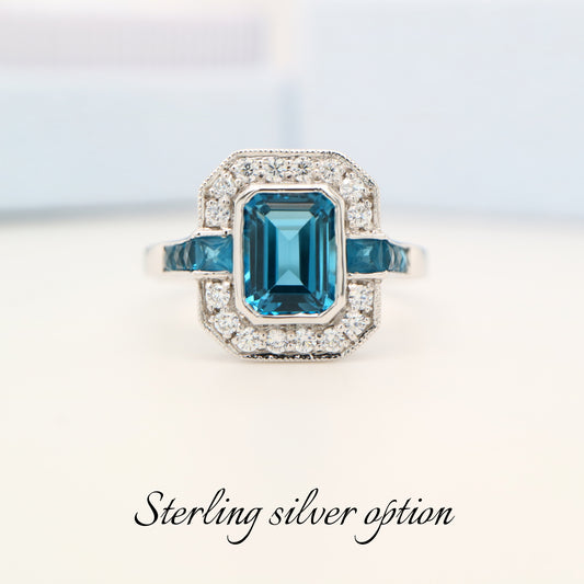 London blue topaz ring in Sterling Silver with CZ halo