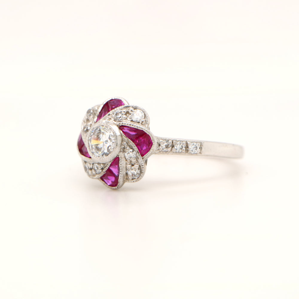 Diamond and ruby ring on a white background
