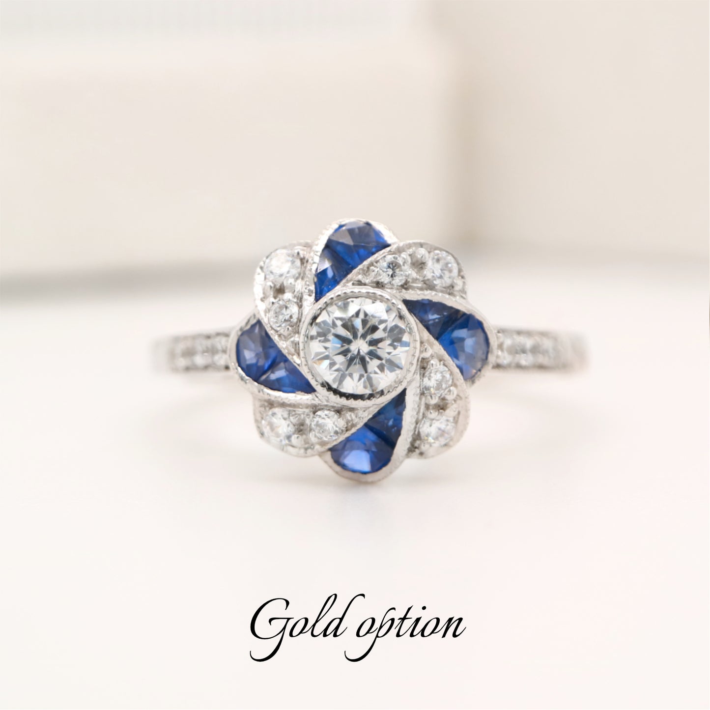 Vintage pinwheel white gold, sapphire and diamond ring
