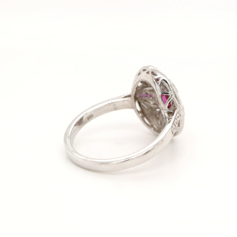 Art deco cross style ring in white gold and ruby with diamonds