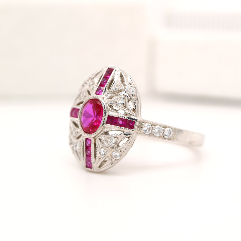 Art deco cross style ring in white gold and ruby with diamonds