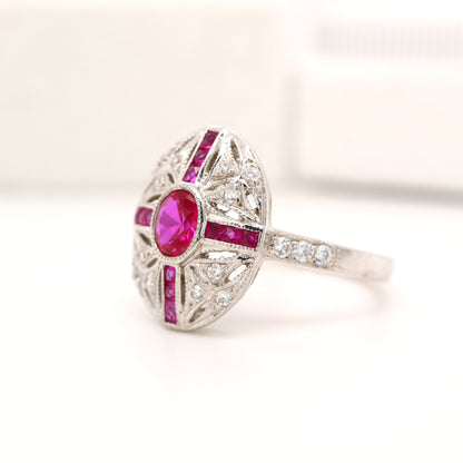 Art deco cross style ring in white gold and ruby with diamonds