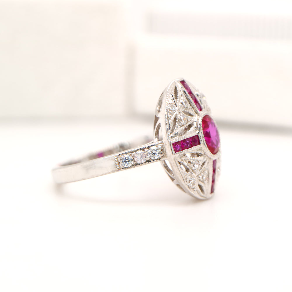 Art deco cross style ring in white gold and ruby with diamonds
