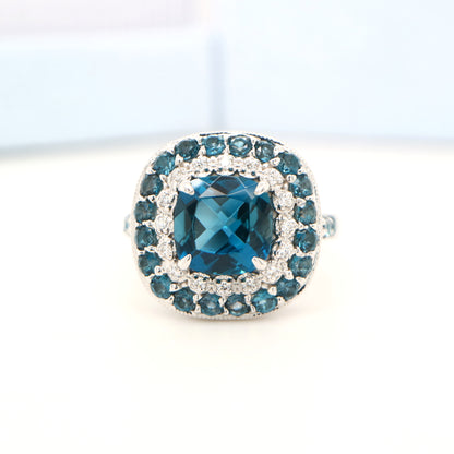London blue topaz cocktail ring with cz and london blue topaz halo in sterling silver