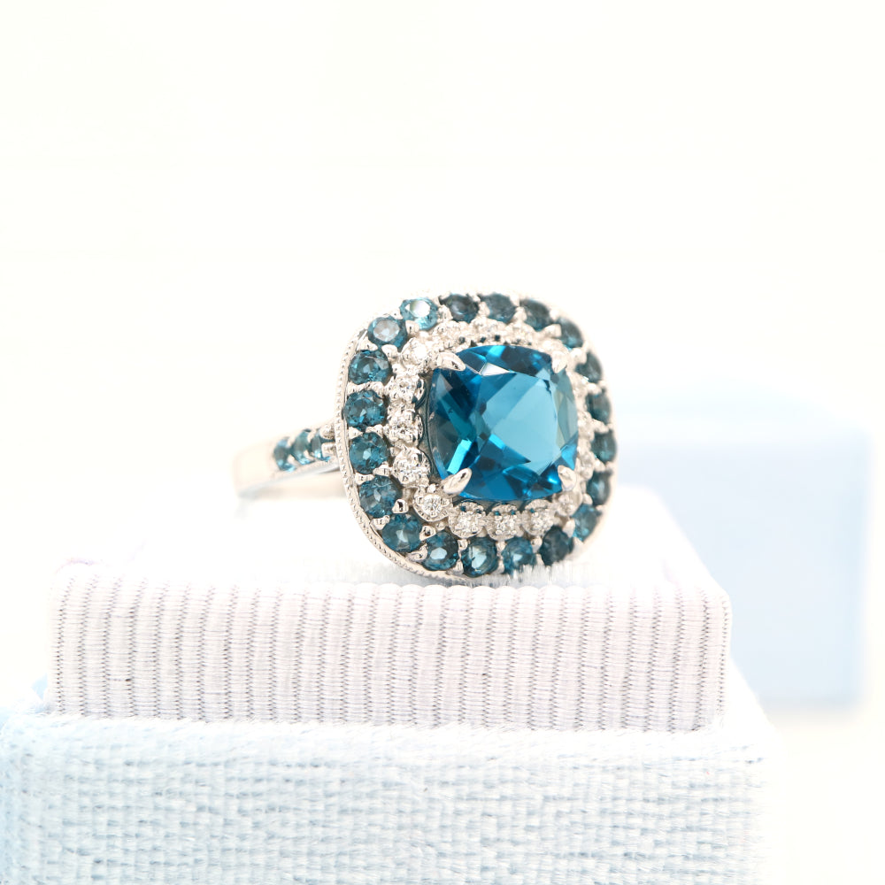 London blue topaz cocktail ring with cz and london blue topaz halo in sterling silver