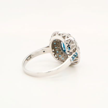 London blue topaz cocktail ring with cz and london blue topaz halo in sterling silver