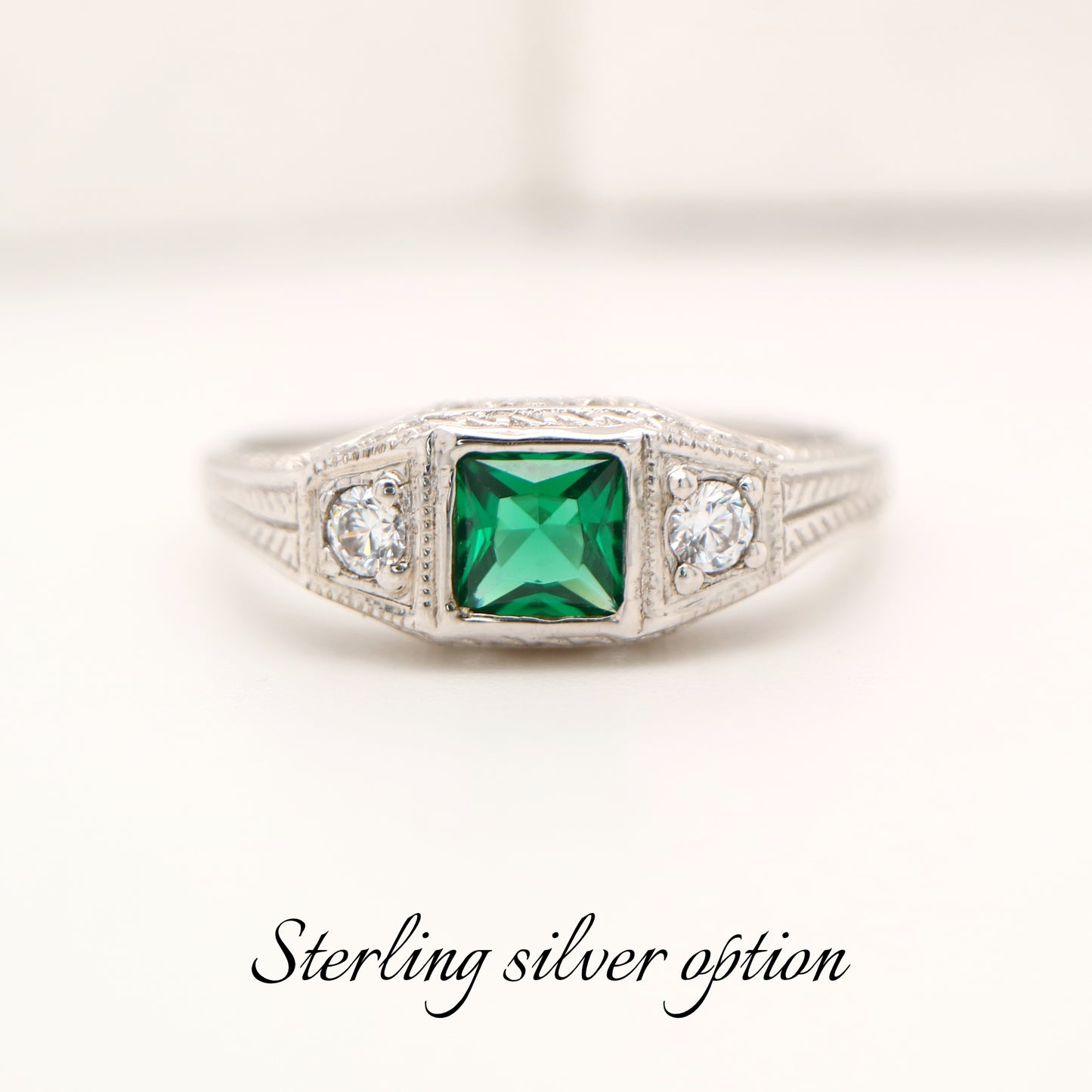 Art deco sterling silver ring with laboratory grown emerald and shoulder cz