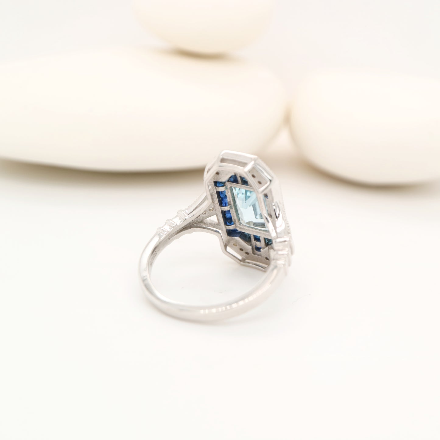 Art deco aquamarine cocktail ring with sapphire halo in white gold