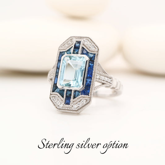 Art deco topaz cocktail ring with natural sapphire halo in sterling silver