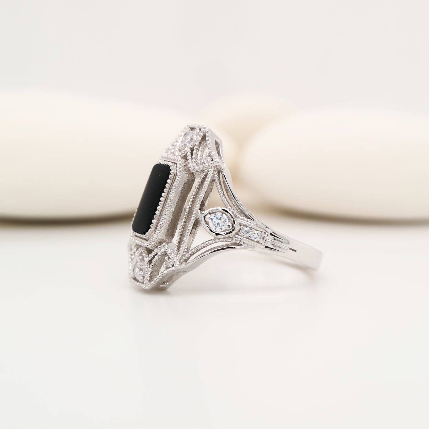 Cocktail shield ring with onyx and diamonds in sterling silver