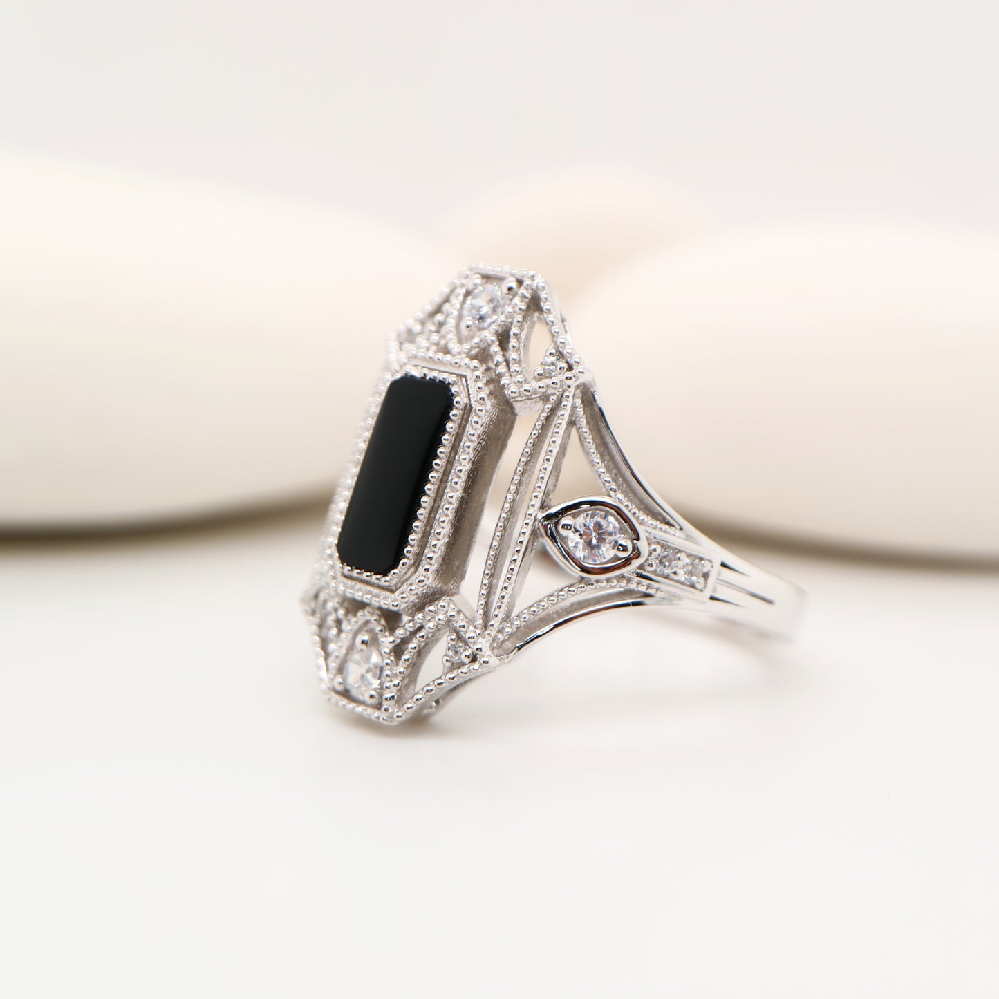 Cocktail shield ring with onyx and diamonds in sterling silver