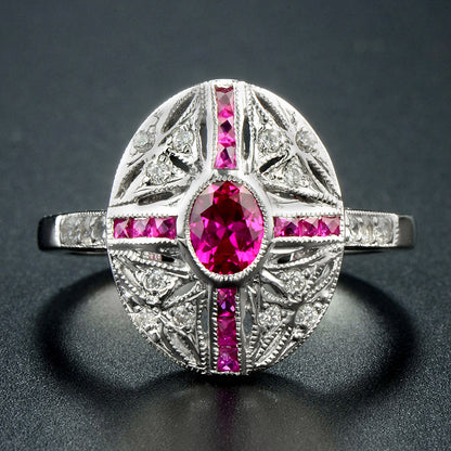 Art deco cross style ring in white gold and ruby with diamonds